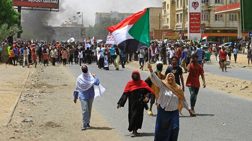 Sudanese anti-coup protesters march during a demonstration in Omdurman, the capital Khartoum's twin city, on June 30