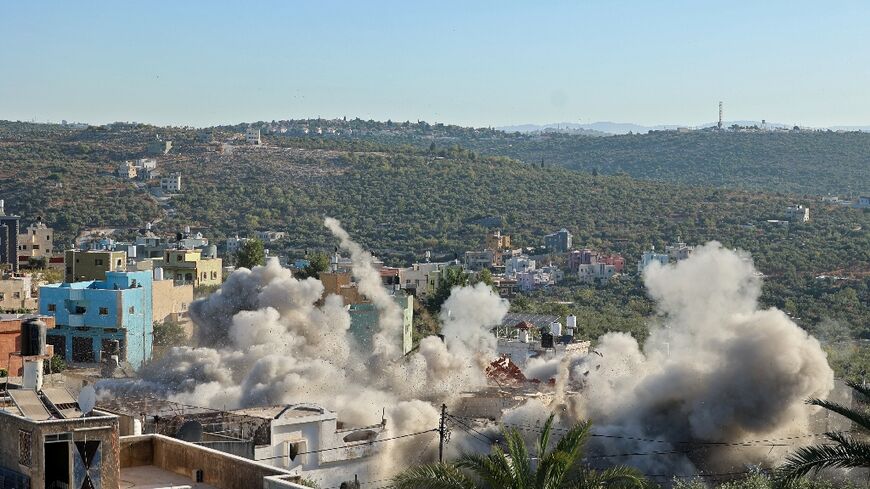 Israeli troops demolish the West Bank home of Yehya Miri, one of two Palestinians suspected of carrying out a deadly shooting attack in the Jewish settlement of Ariel