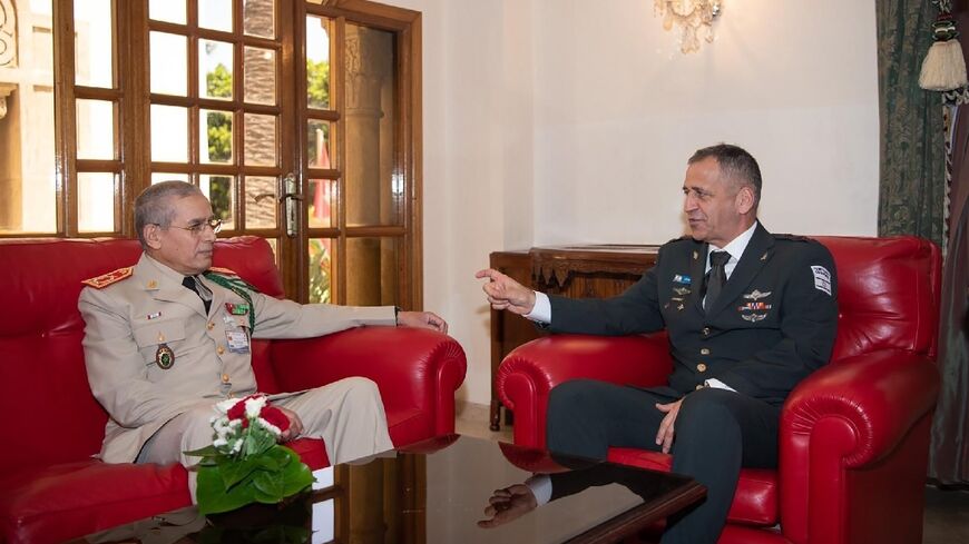 This handout picture released by the Israeli army shows Chief of Staff Aviv Kohavi (R) meeting with his Moroccan counterpart Belkhir El-Farouk at the Royal Moroccan Armed Forces (FAR) in Rabat on July 19, 2022