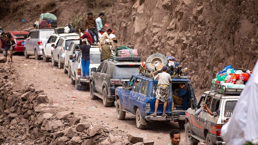 Traffic on a heavily damaged narrow road that serves as a lifeline between the Yemeni city of Taez, besieged by Huthi rebels, and the southern port of Aden