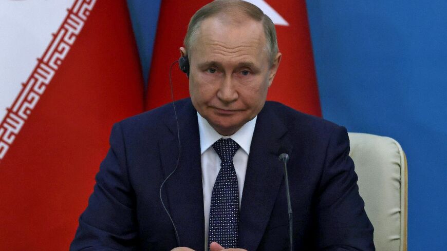 Russian President Vladimir Putin looks on during a joint press conference with his Iranian and Turkish counterparts following their summit in Tehran 