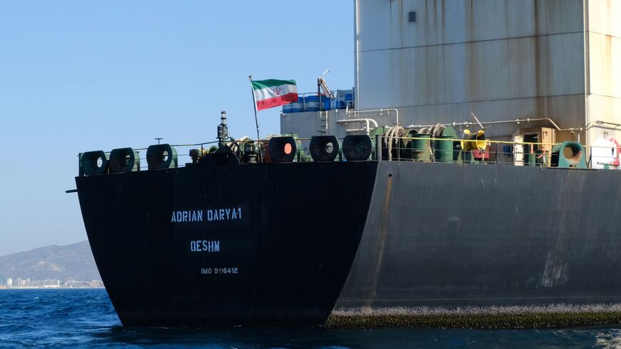 TOPSHOT - An Iranian flag flutters on board the Adrian Darya oil tanker, formerly known as Grace 1, off the coast of Gibraltar on August 18, 2019. - Gibraltar rejected a US demand to seize the Iranian oil tanker at the centre of a diplomatic dispute as it prepared to leave the British overseas territory after weeks of detention. (Photo by Johnny BUGEJA / AFP) (Photo by JOHNNY BUGEJA/AFP via Getty Images)