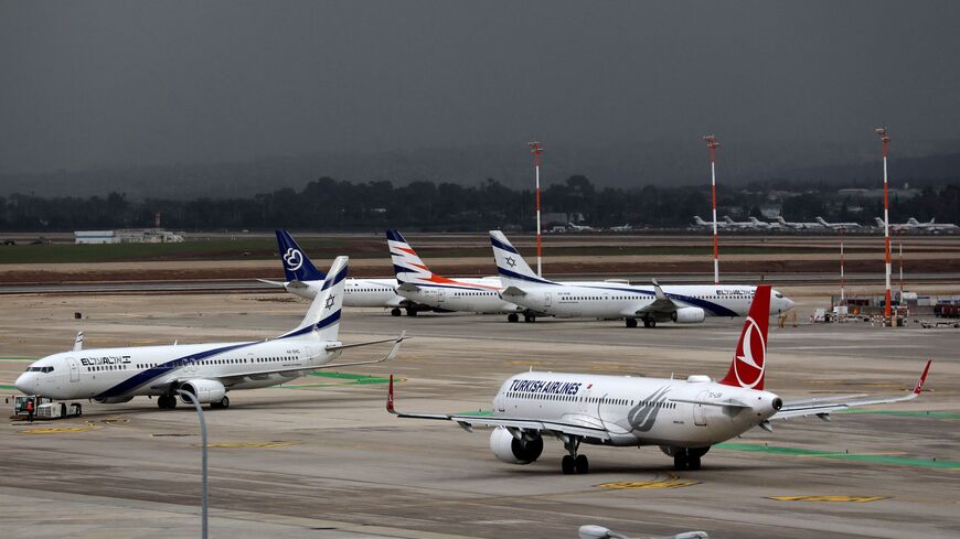 (Foreground L to R) a Boeing 737 aircraft of Israel's El Al and an Airbus A321 aircraft of Turkish Airlines.