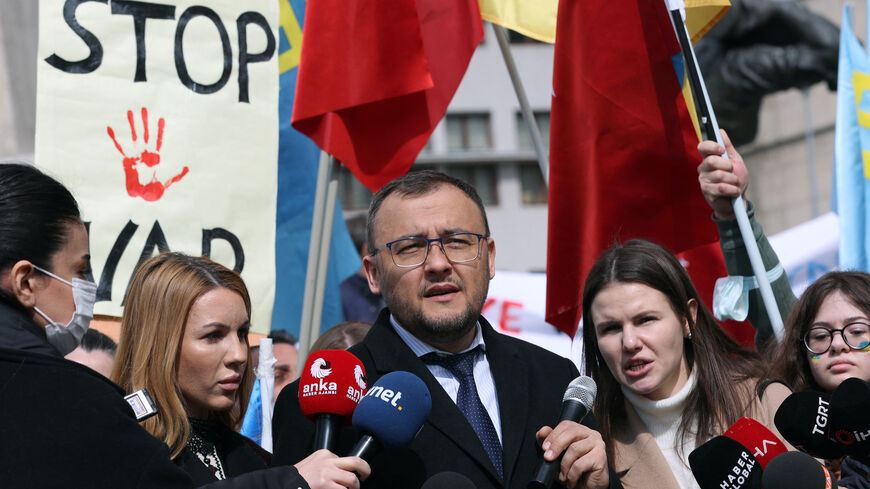 Ukrainian Ambassador to Turkey Vasyl Bodnar (C) speaks to media as he takes part in a protest against Russia's military invasion of Ukraine at Ulus districit in Ankara, on March 5, 2022. 