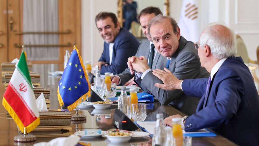 Josep Borell, the High Representative of the European Union for Foreign Affairs and Security Policy (R), and Deputy Secretary General of the European External Action Service (EEAS) Enrique Mora (2nd-R) chat during a meeting with Iran's Foreign Minister at the foreign ministry headquarters in Iran's capital Tehran on June 25, 2022. 