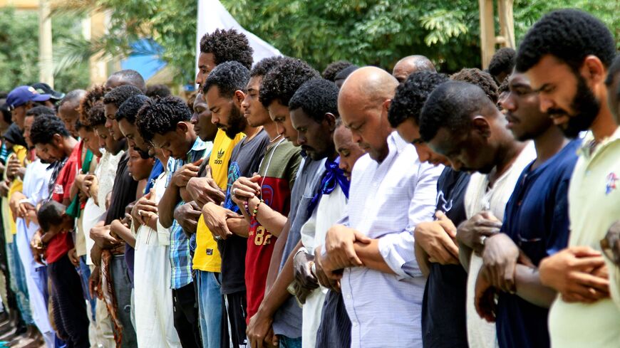 Sudanese demonstrators perform the Friday noon prayers in the southern area of Khartoum on July 1, 2022.