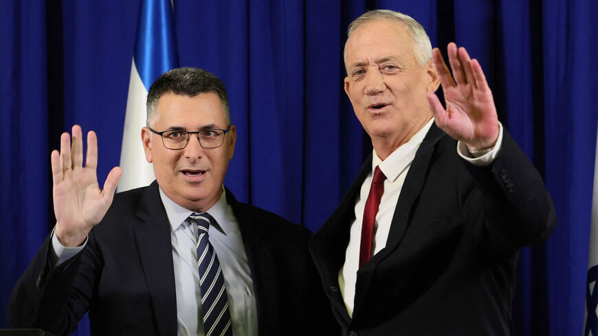Israeli Defense Minister and Blue and White party chief Benny Gantz and Justice Minister and New Hope party chief Gideon Saar wave during a joint press conference, Ramat Gan, Israel, July 10, 2022.