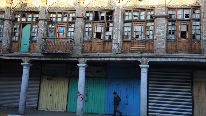 A picture taken on Jan. 29, 2018, shows a man walking on the Iraqi capital's Rasheed Street, one of the oldest streets of the city.