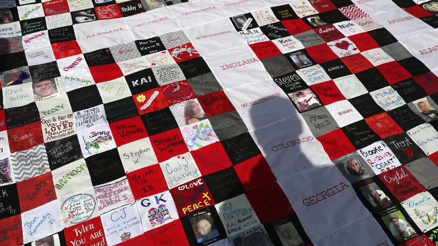 A quilt made in honor of people who died of opioid and heroin overdoses take part in the 'Fed Up!' rally to end the national epidemic on at the National Mall in September 2016 in Washington, DC