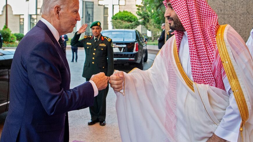 Saudi Crown Prince Mohammed bin Salman (R) bumps fists with US President Joe Biden at Al-Salam Palace in the Red Sea port of Jeddah