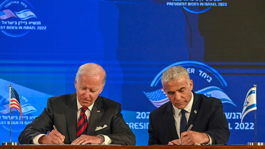 US President Joe Biden and Israeli Prime Minister Yair Lapid sign the Jerusalem Declaration, Waldorf Astoria Hotel, Jerusalem, July 14, 2022.