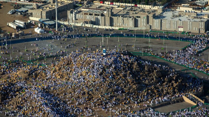 An aerial view shows Muslim pilgrims gathering atop Mount Arafat, also known as Jabal al-Rahma (Mount of Mercy), near the holy city of Mecca, during the climax of the Hajj pilgrimage on July 8, 2022