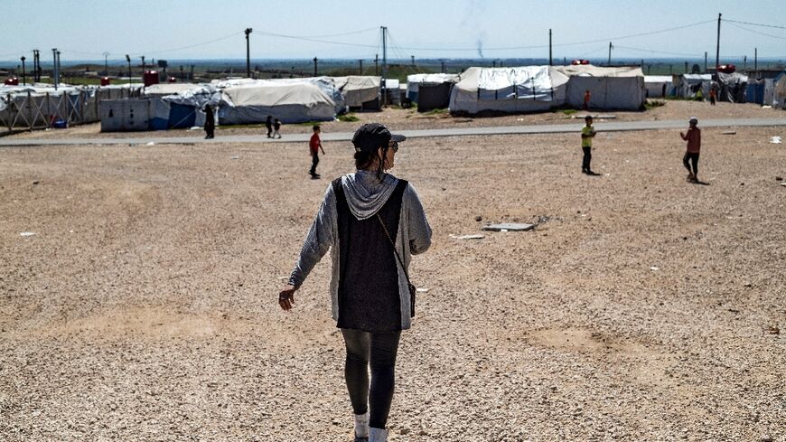 Emilie Konig, a Muslim convert from northwest France who became a notorious recruiter for the Islamic State group, pictured in the Al-Roj camp in northeastern Syria in 2021, is expected to face judicial proceedings after being repatriated