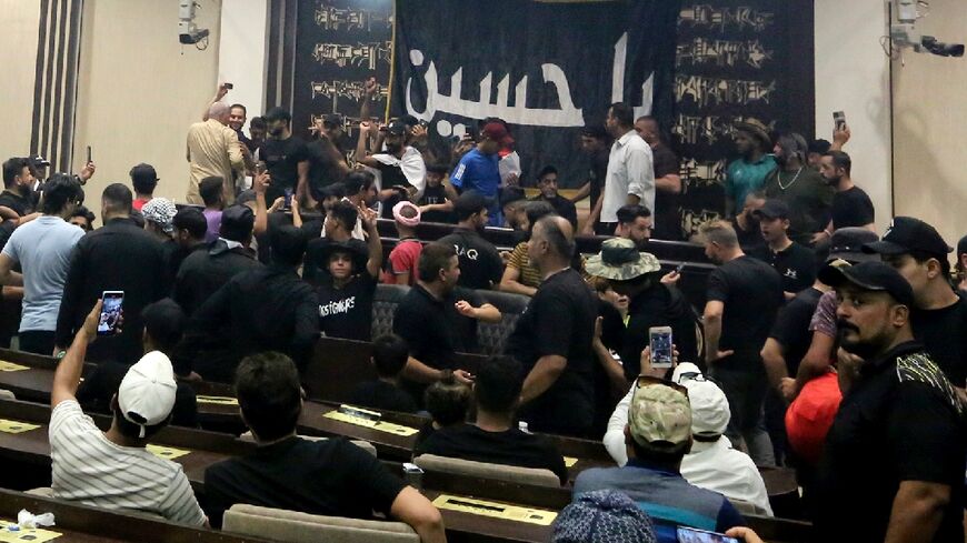 Followers of mercurial Iraqi cleric Moqtada continued their sit-in at parliament on Sunday, as the preacher called on other factions to support his protest initiative