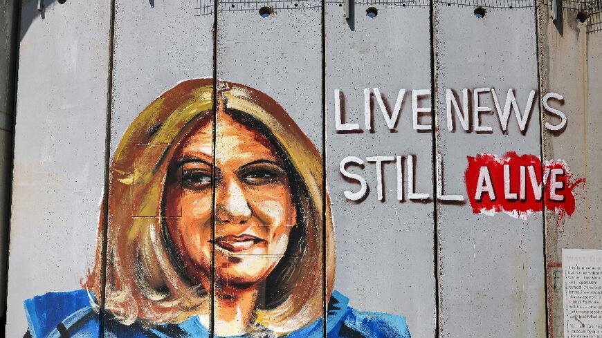A mural in Bethlehem, in the occupied West Bank, depicts slain Al Jazeera journalist Shireen Abu Akleh
