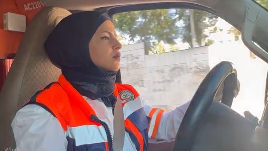 Palestinian ambulance driver Sandra Bali behind the wheel during her shift, Gaza Strip, August 2022.