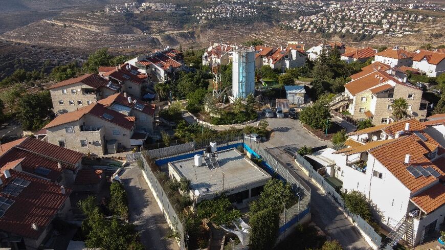 For years the Palestinian family home stood amid swathes of farmland, but now it lies behind a yellow gate controlled by Israeli soldiers