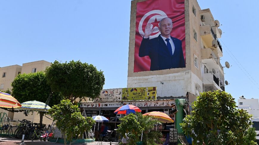 A billboard depicting Tunisia's President Kais Saied hangs on the side of a building in the central city of Kairouan, on July 26, 2022