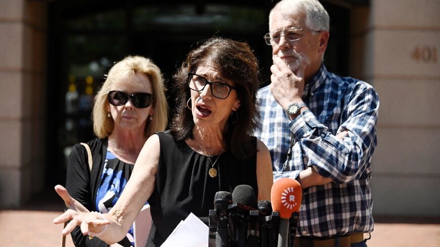 Diane Foley (C), the mother of James Foley, and Carl and Marsha Mueller, the parents of Kayla Mueller, speak to reporters outside the Albert V. Bryan Federal Courthouse following the sentencing of former Islamic State 'Beatle' El Shafee Elsheikh