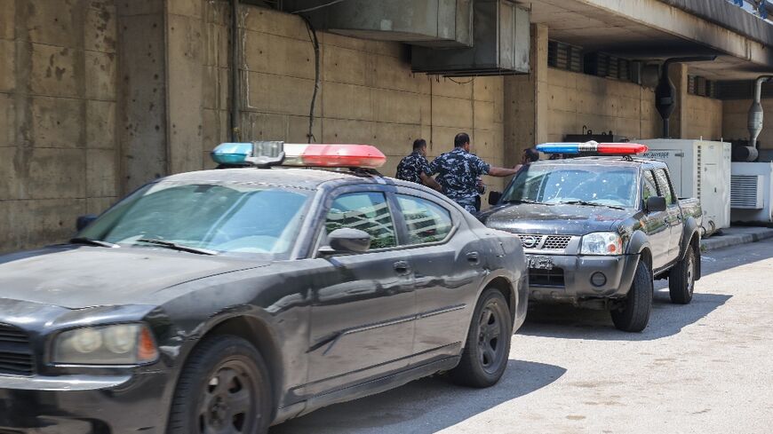 Members of Lebanon's security forces deploy on a street with access to a detention center under the Adlieh (Palace of Justice) bridge in the capital Beirut following a dawn prison break