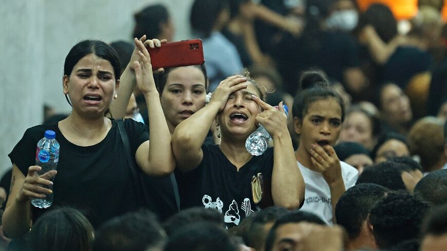 Mourners at the funeral of victims killed in Sunday's Coptic church fire in the Imbaba neighbourhood of greater Cairo