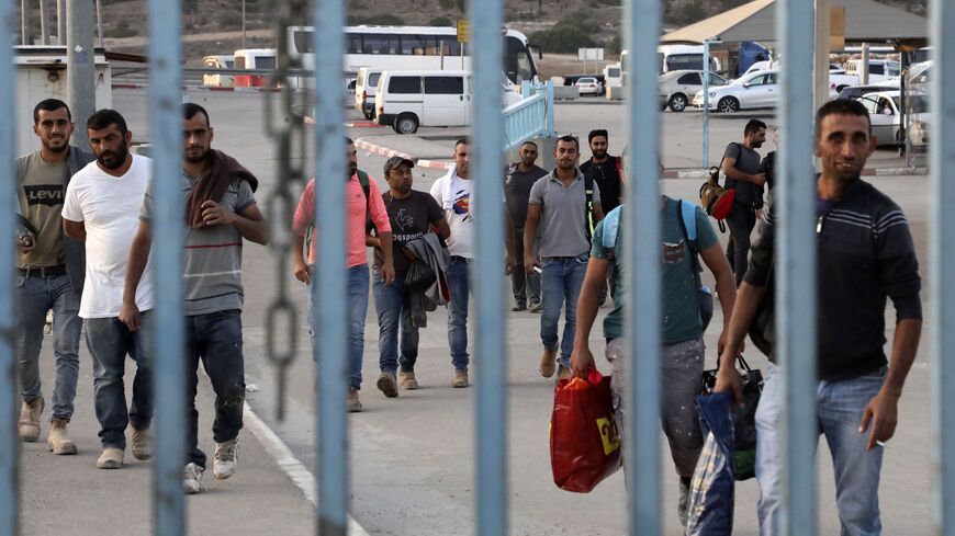 A picture taken from the Israeli side of the Tarkumiya checkpoint near Kiryat Gat shows Palestinian workers. 