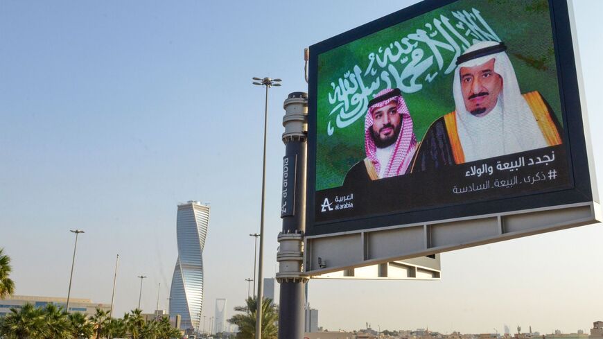 A picture taken on Nov. 18, 2020, shows an electronic billboard bearing portraits.