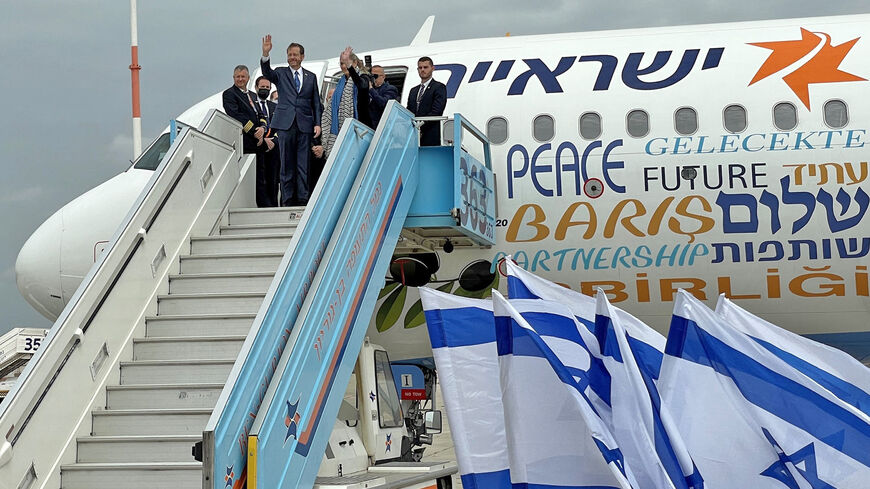 Israel's President Isaac Herzog waves as he departs for an official visit to Turkey on March 9, 2022.