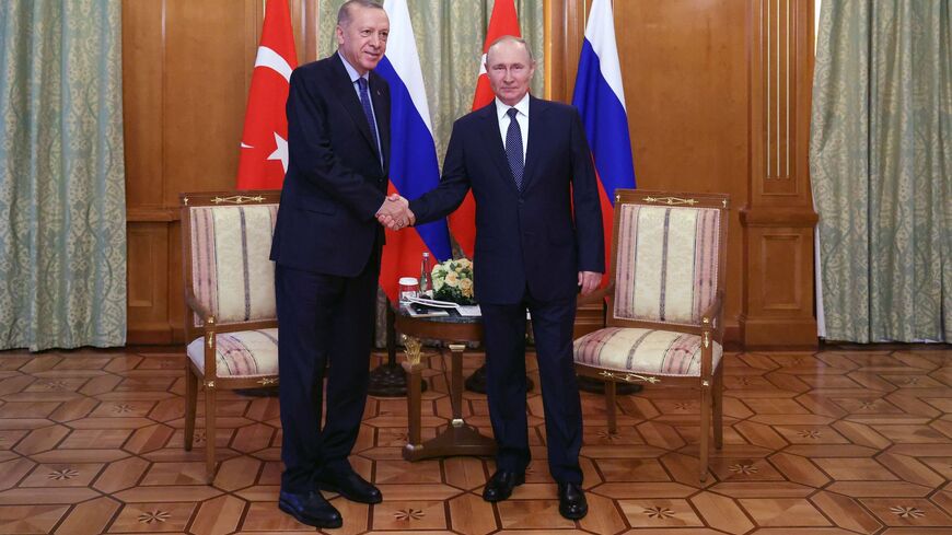 Russian President Vladimir Putin (R) shakes hands with Turkish President Recep Tayyip Erdogan (L) during a meeting in Sochi, on Aug. 5, 2022.