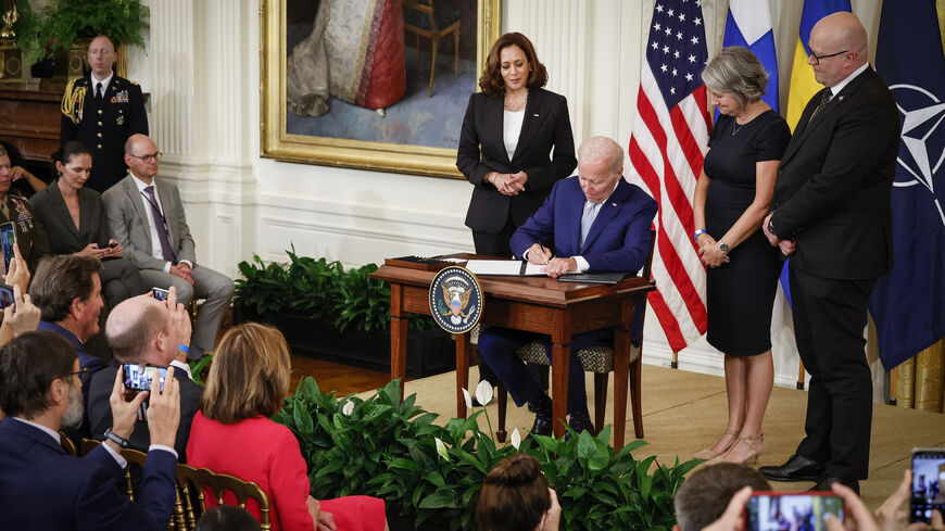 US President Joe Biden signs the agreement for Finland and Sweden to be included in the North Atlantic Treaty Organization.