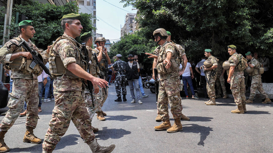 Army soldiers gather near a Federal Bank branch, Beirut, Lebanon, Aug. 11, 2022.