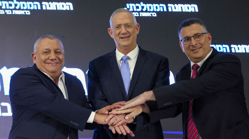 Israel's former army Chief of Staff Gadi Eisenkot, Defense Minister and Blue and White party chief Benny Gantz, and Justice Minister and New Hope party chief Gideon Saar pose for pictures during a joint press conference, Ramat Gan, Israel, Aug. 14, 2022.