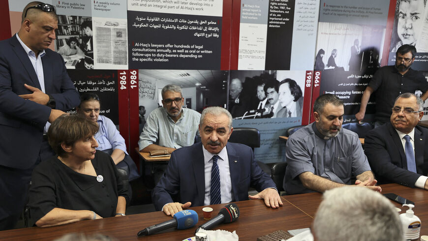 Palestinian Prime Minister Mohammad Shtayyeh speaks at the Al-Haq Foundation after Israel raided and closed an entrance to their offices, Ramallah, West Bank, Aug. 18, 2022.