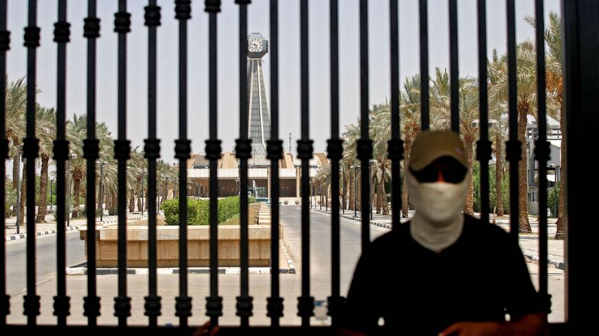 A man stands outside the headquarters of the Supreme Judicial Council.