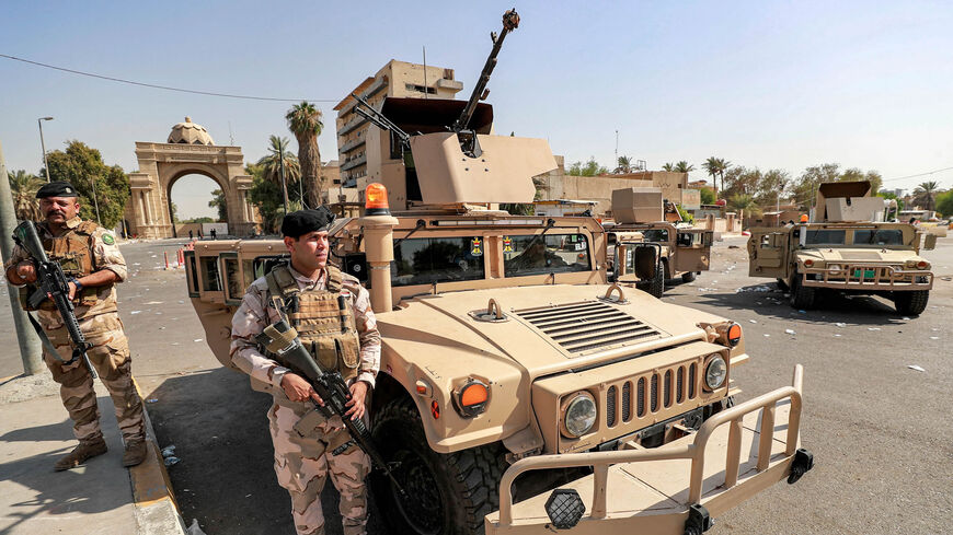 Iraqi army forces deploy to guard the entrance of the high-security Green Zone after the withdrawal of supporters of Shiite Muslim cleric Muqtada al-Sadr from the area, Baghdad, Iraq, Aug. 30, 2022.