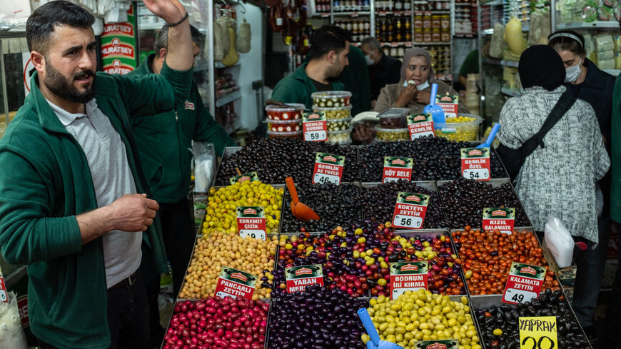 People shop in a busy market ahead of the start of the holy month of Ramadan on April 1, 2022, in Istanbul, Turkey. 