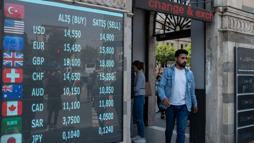A man walks past a currency exchange office on May 05, 2022, in Istanbul, Turkey.