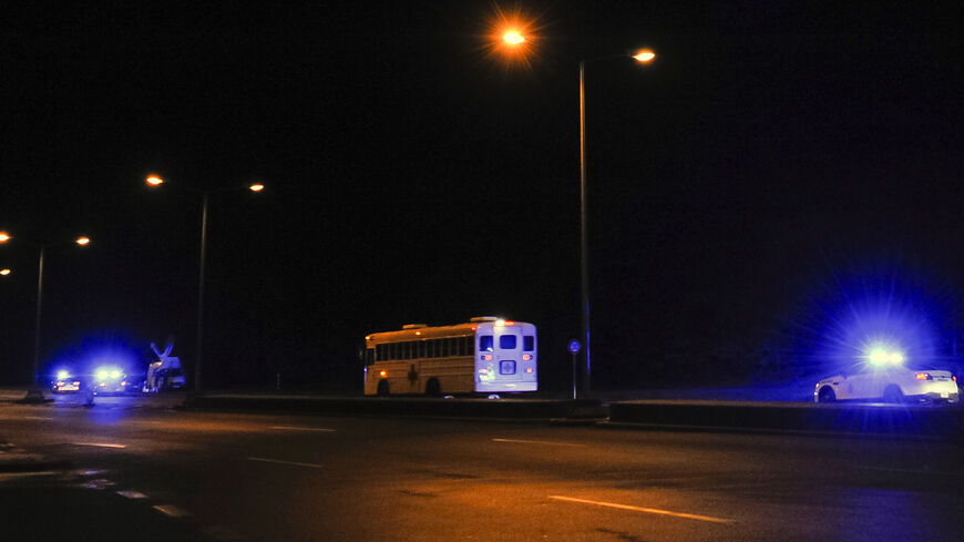 A picture taken on Jan. 17, 2016, shows a medical bus escorted by German and American police leaving the US air base.