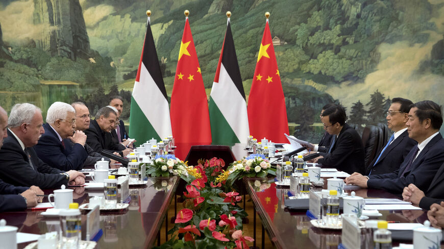 Palestinian President Mahmoud Abbas (2nd L) listens as Chinese Premier Li Keqiang (2nd R) speaks.