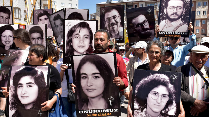 Turkish activists and opposition members gather with pictures of victims — largely from the Alevi community — killed in Madimak Otel on July 2, 2018, in Sivas. 