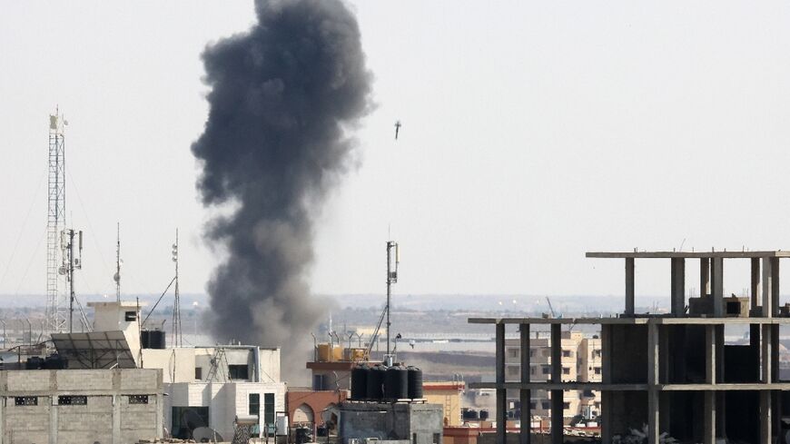 Smoke billows as a bomb drops on a target in Rafah in the southern Gaza Strip during an Israeli airstrike on August 7, 2022