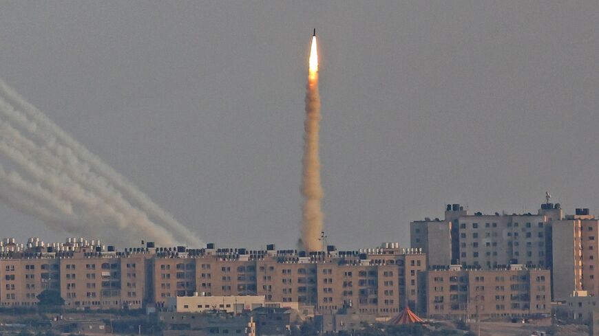 This picture taken from the southern Israeli city of Ashkelon shows Palestinian rockets fired from the Gaza Strip on August 7, 2022 -- Israel insisted some militant rockets misfired with deadly results, and some Palestinian residents agreed