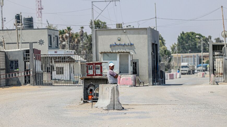 A man stands outside the closed Kerem Shalom crossing with Israel in Rafah in the southern Gaza Strip 
