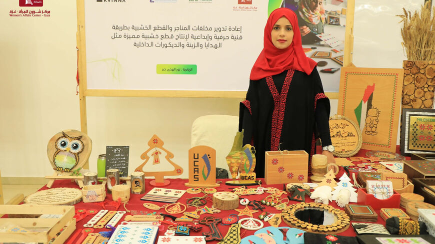 This photo shows Noor al-Huda Jaber, owner of the Noor Recycling Initiative, which uses wood waste to produce decorations and gifts, Gaza City, Gaza Strip, Sept. 7, 2022.