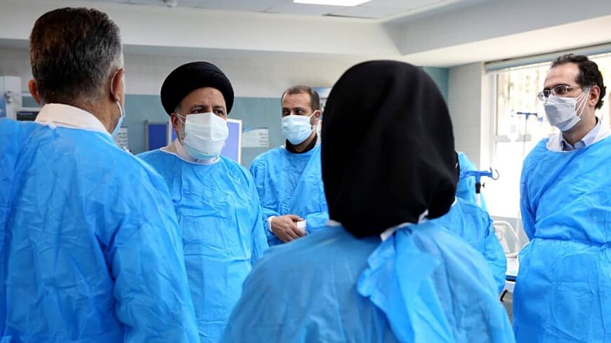 Iranian President Ebrahim Raisi visits a hospital in Tehran in August 2021