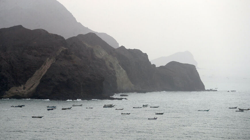 A picture taken on Aug. 10, 2018 during a trip in Yemen organized by the UAE's National Media Council (NMC) shows a view of Yemeni fishing boats along the Yemeni side of the strategic strait of Bab al-Mandab, which separates the Arabian Peninsula from east Africa. 