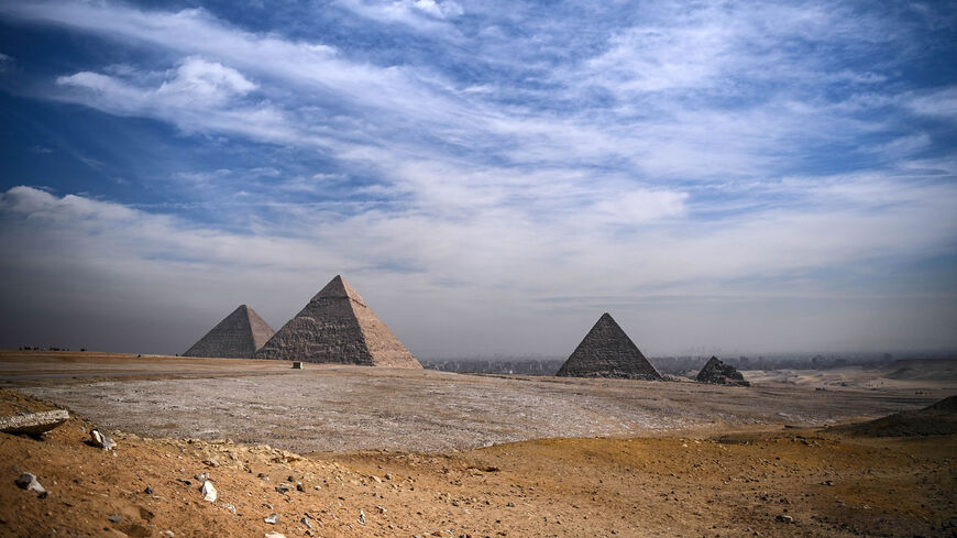 This picture shows the pyramids of Khufu (Cheops) (L), Khafre (Chephren) (C) and Menkaure (Menkheres), at the Giza pyramids necropolis on the southwestern outskirts of Cairo, Egypt, Jan. 26, 2021.