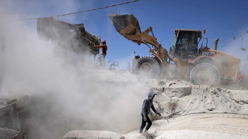 Palestinian laborers work at a stone quarry during International Workers Day, Gaza City, Gaza Strip, May 1, 2021.