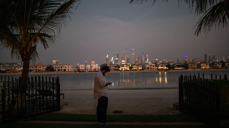Rabbi Eli, from CTeen International, an orthodox Jewish teen network, checks his phone during the first Sukkot Hop ever to be held in Dubai, United Arab Emirates, Sept. 23, 2021. 