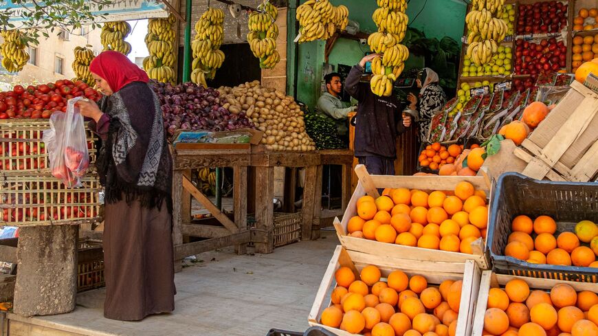 An Egyptian woman shops at a fruit market in Cairo on March 17, 2022.
